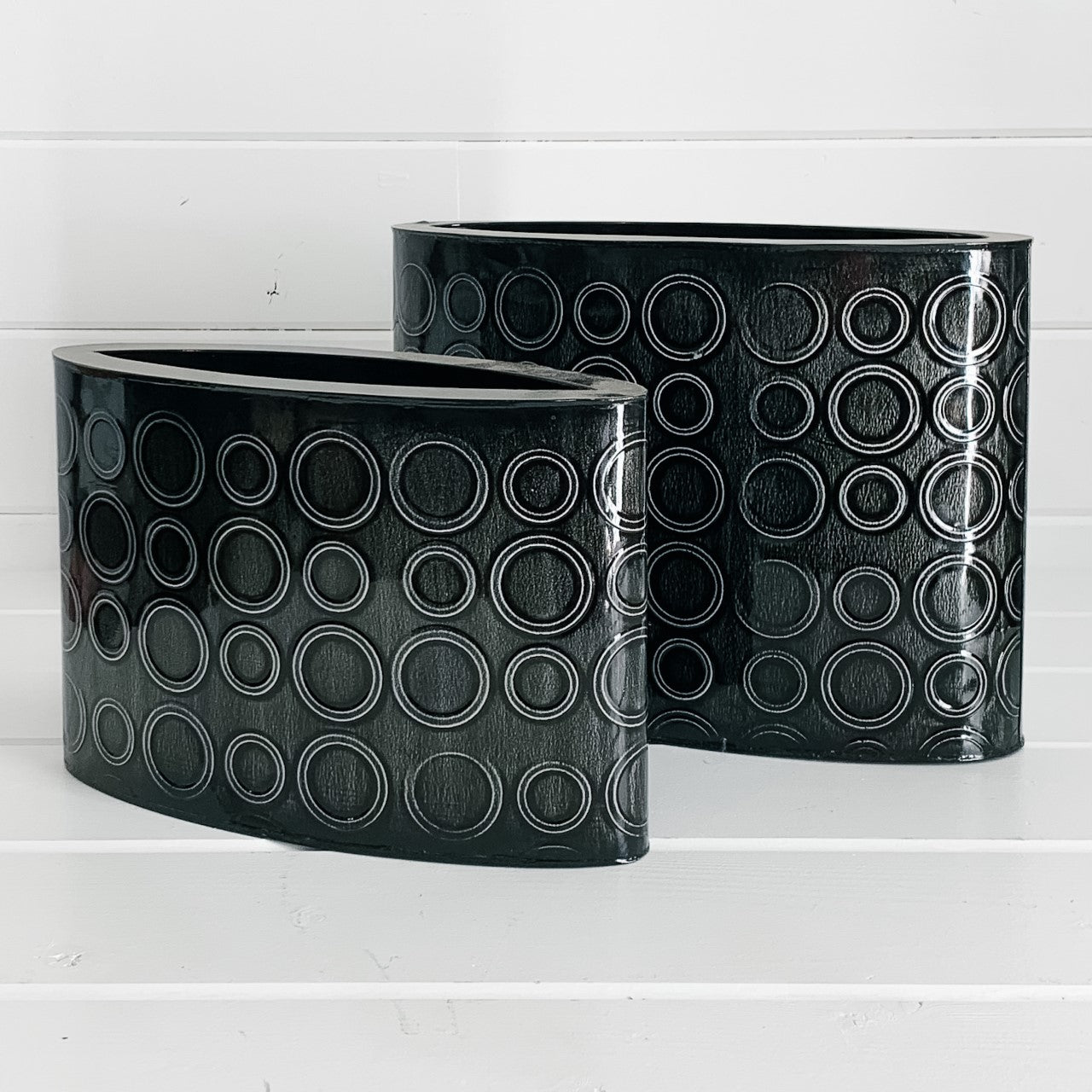Oval black metal decorative tins