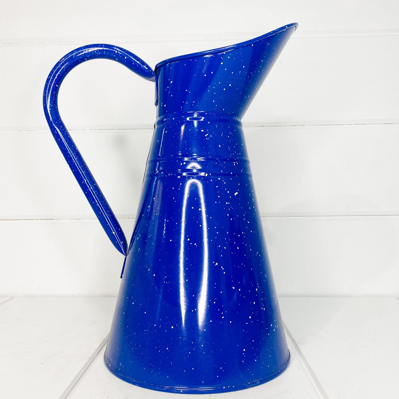 Blue speckled tin pitcher