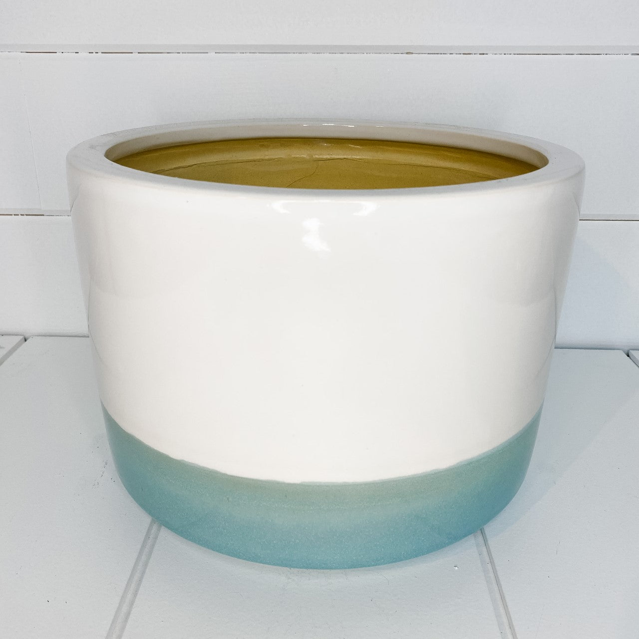 White/teal ceramic planter