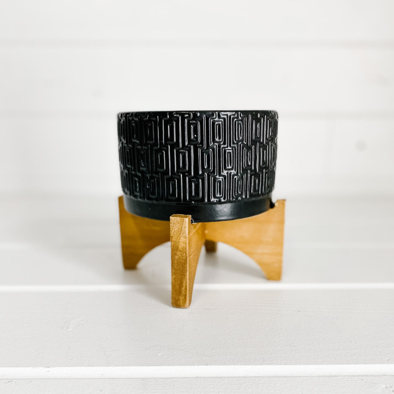 Black Design Pot on Wooden Stand